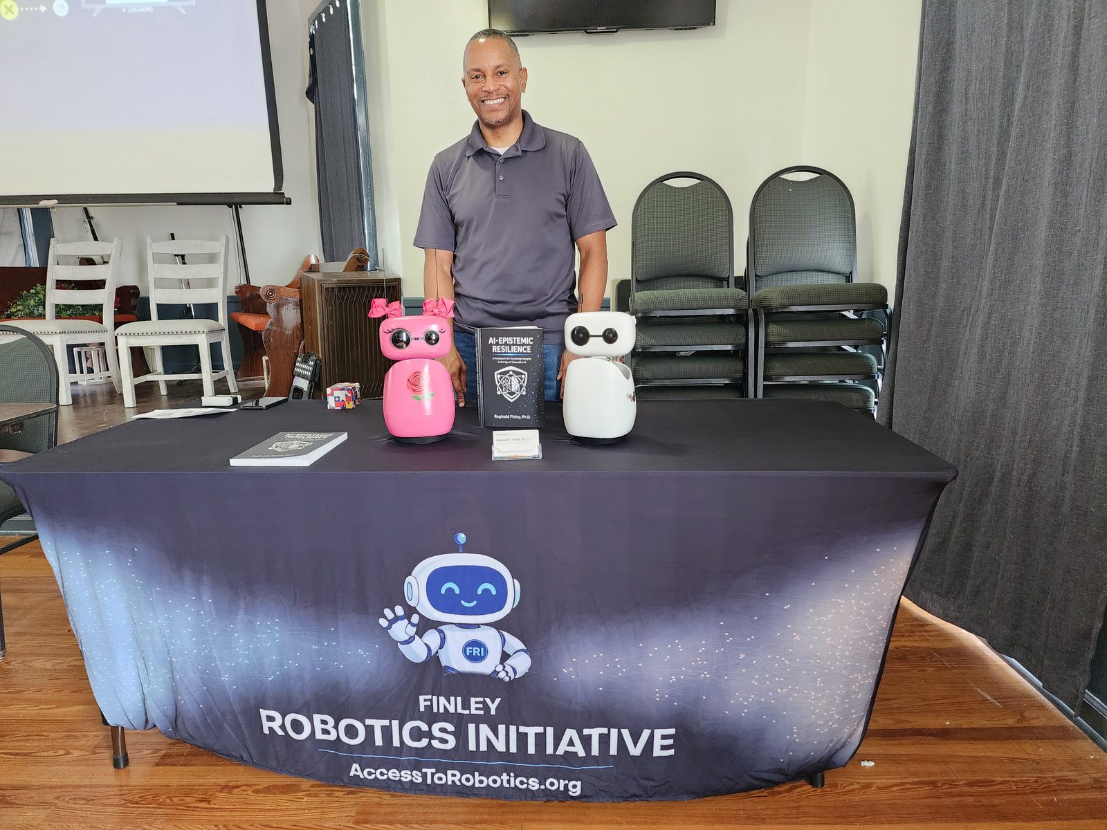 Dr. Finley with Aiden and Rose and a copy of AI-Epistemic Resilience at the Atlanta Freethought Society